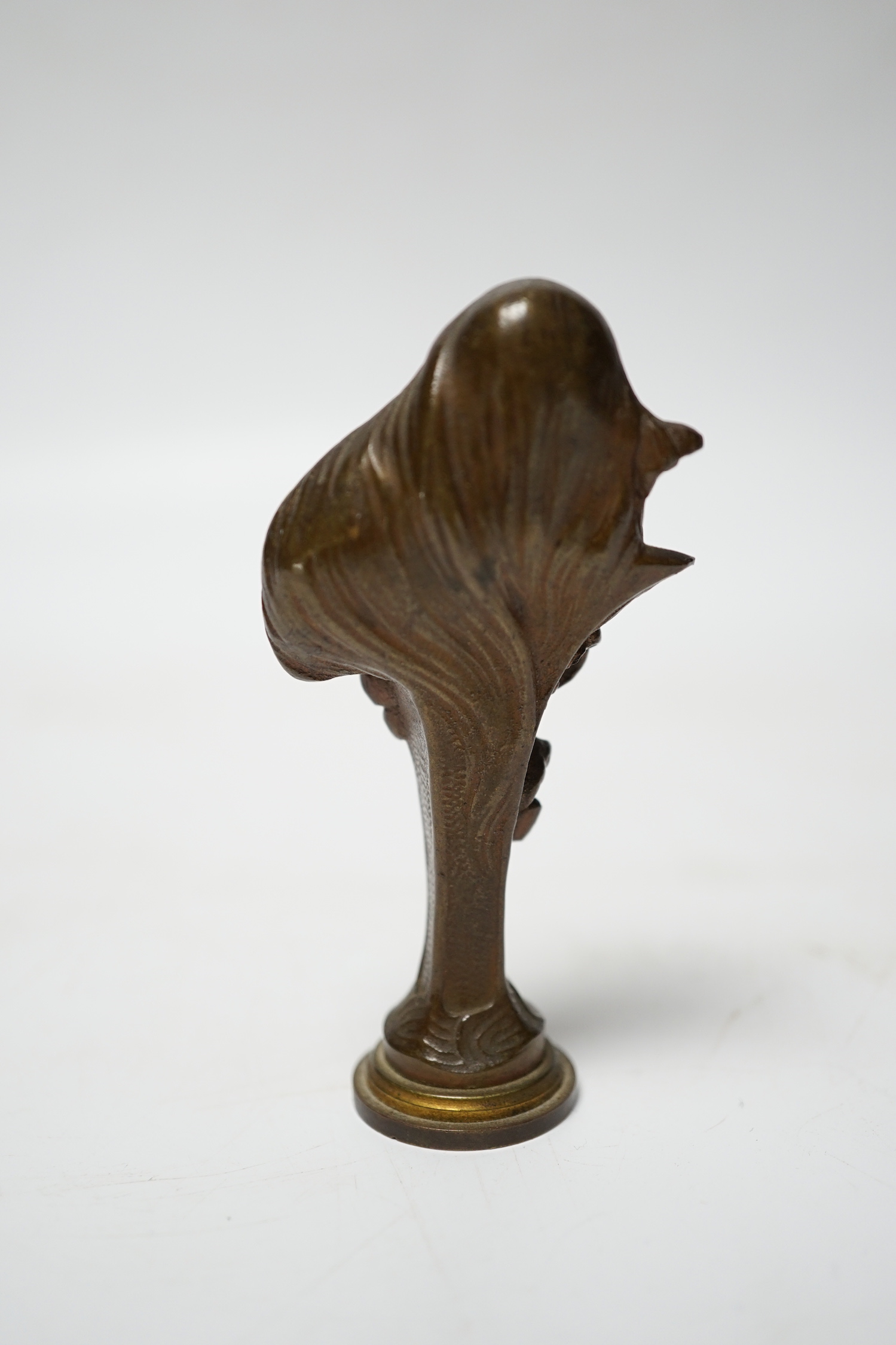 A small Art Nouveau figural bronze desk seal, 8.5cm high